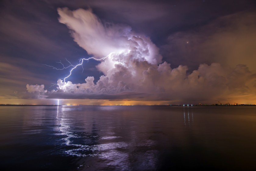 Long exposure photograph of lightning illuminating clouds over Tampa Bay, viewed from Vinoy Park in St. Petersburg, Florida.